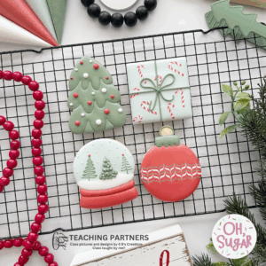 four cookie image. tree, ornament, snow globe and gift
